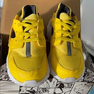 Yellow Nike huaraches